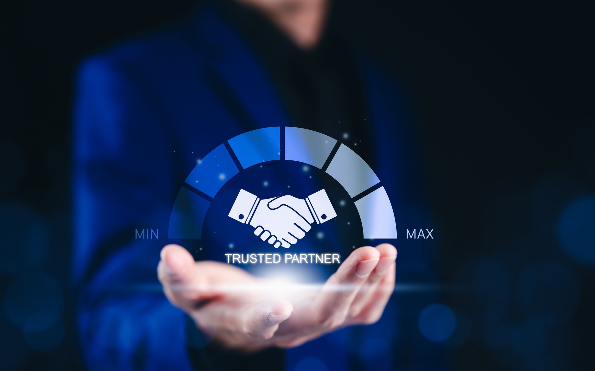Trusted Partner and Business Collaboration Concept. Businessman holding glowing handshake icon with a trust level gauge, business partnership, reliability, and professional collaboration. trustworthy,